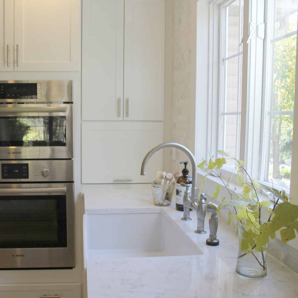 My white modern farmhouse style kitchen with Viatera Minuet quartz countertops--read more about how I arrived at this shade of white quartz for the project. #minuet #quartz #kitchendesign