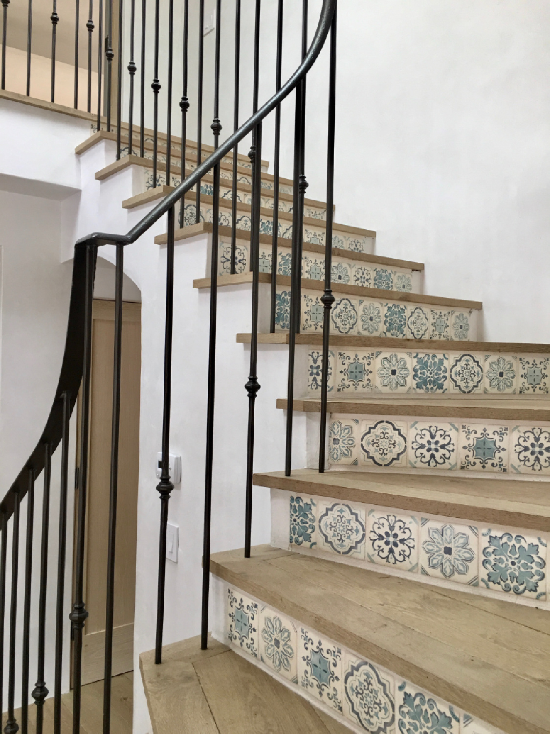 Tiled staircase - Steve Giannetti designed modern Mediterranean Malibu home with white oak, natural finishes, limestone, and Old World style. #giannettihome #patinastyle #patinahomes