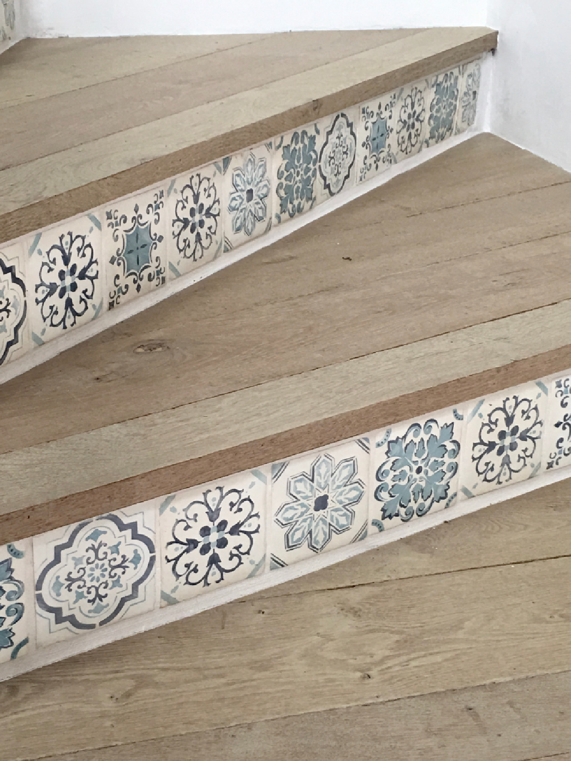 Detail of Mediterranean tile on stairs. Steve Giannetti designed modern Mediterranean Malibu home with white oak, natural finishes, limestone, and Old World style. #giannettihome #patinastyle #patinahomes
