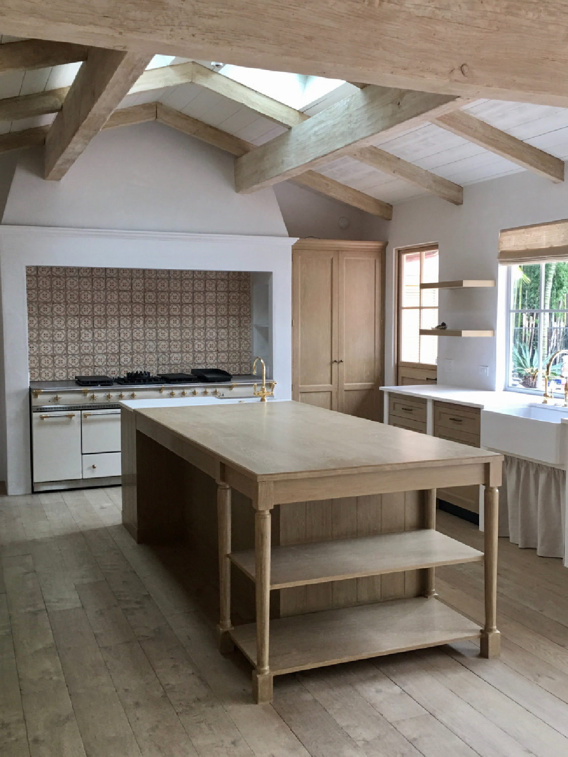 Modern farmhouse kitchen with white oak - Steve Giannetti designed modern Mediterranean Malibu home with white oak, natural finishes, limestone, and Old World style. #giannettihome #patinastyle #patinahomes