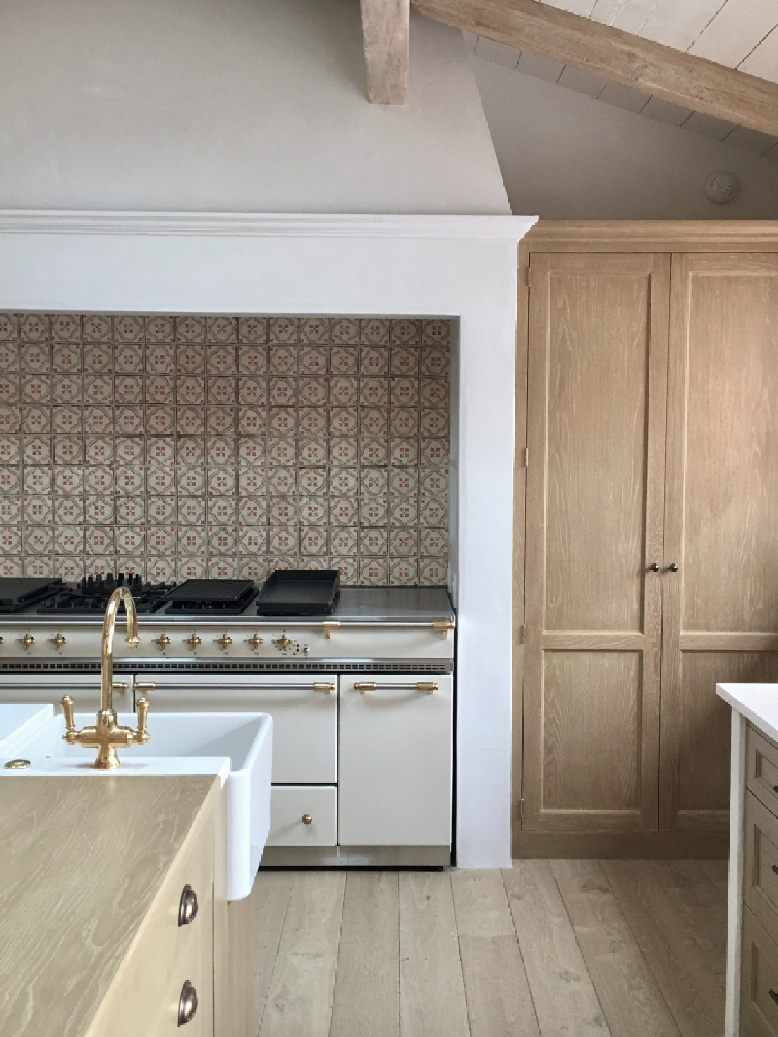 Detail of range and custom hood - Steve Giannetti designed modern Mediterranean Malibu home with white oak, natural finishes, limestone, and Old World style. #giannettihome #patinastyle #patinahomes