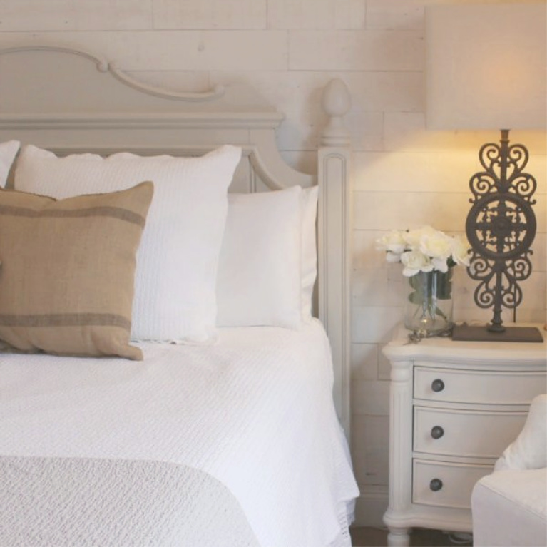 Stikwood Hamptons reclaimed pine peel and stick wood statement wall in our white French country romantic bedroom - Hello Lovely Studio. #frenchcountry #hellolovelystudio #bedroomdecor #stikwood #hamptons #shiplap #woodplank #statementwall
