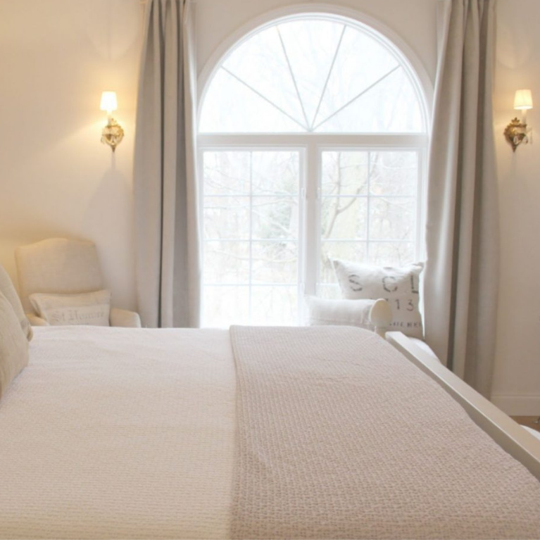 White French country cottage bedroom with Stikwood (hamptons) statement wall, white oak hardwood, and rustic alder doors. #hellolovelystudio #frenchcountry #bedroomdecor #rusticelegance #whiteoak #frenchbedrooms #alderdoor #stikwood #hamptons #romanticdecor #whitebedrooms #interiordesign