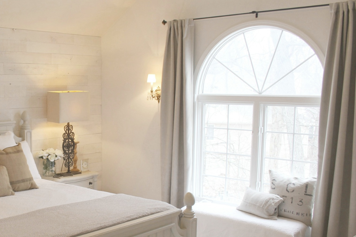 White French country cottage bedroom with Stikwood (hamptons) statement wall, white oak hardwood, and rustic alder doors. #hellolovelystudio #frenchcountry #bedroomdecor #rusticelegance #whiteoak #frenchbedrooms #alderdoor #stikwood #hamptons #romanticdecor #whitebedrooms #interiordesign