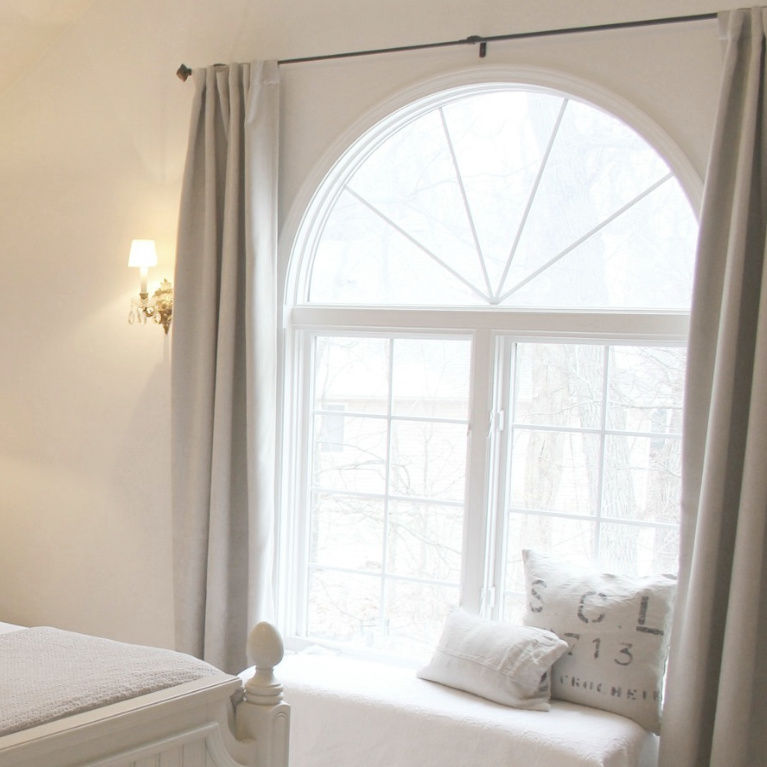 White French country cottage bedroom with Stikwood (hamptons) statement wall, white oak hardwood, and rustic alder doors. #hellolovelystudio #frenchcountry #bedroomdecor #rusticelegance #whiteoak #frenchbedrooms #alderdoor #stikwood #hamptons #romanticdecor #whitebedrooms #interiordesign