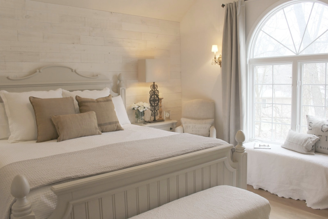 White French country cottage bedroom with Stikwood (hamptons) statement wall, white oak hardwood, and rustic alder doors. #hellolovelystudio #frenchcountry #bedroomdecor #rusticelegance #whiteoak #frenchbedrooms #alderdoor #stikwood #hamptons #romanticdecor #whitebedrooms #interiordesign