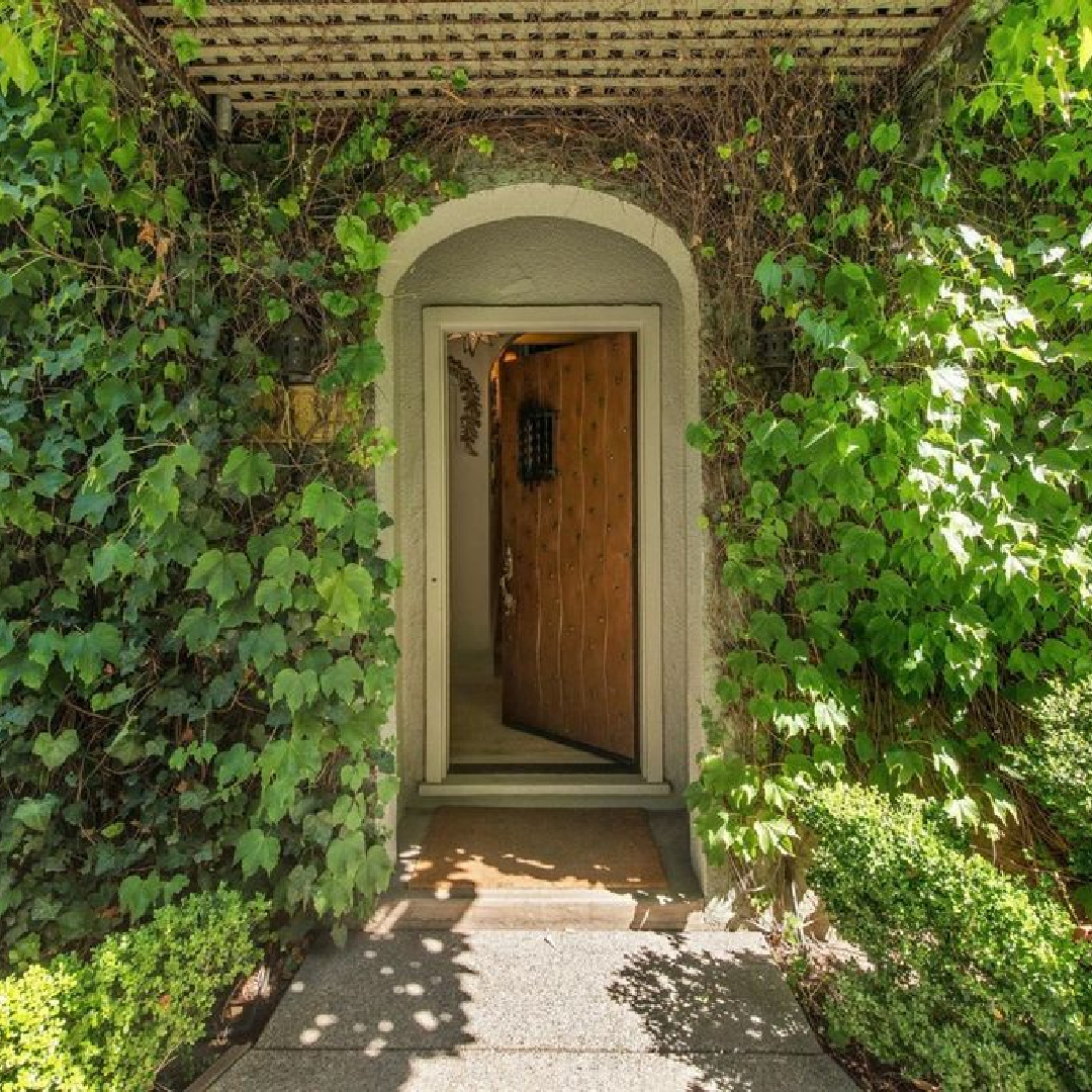 Front door of interior designer Myra Hoefer's beautiful 1935 California cottage with Parisian interiors and French inspired gardens.