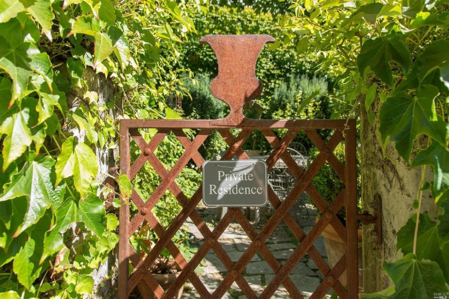 Interior designer Myra Hoefer's beautiful 1935 California cottage with Parisian interiors and French inspired gardens.