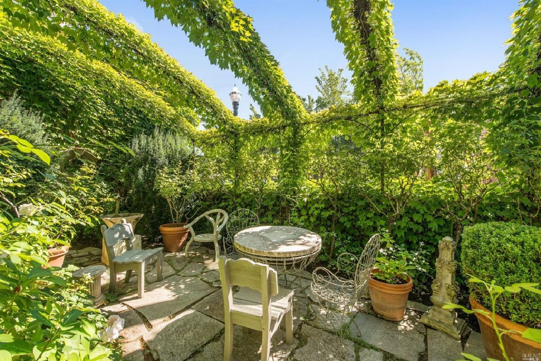 Interior designer Myra Hoefer's beautiful 1935 California cottage with Parisian interiors, antiques, and French inspired gardens.