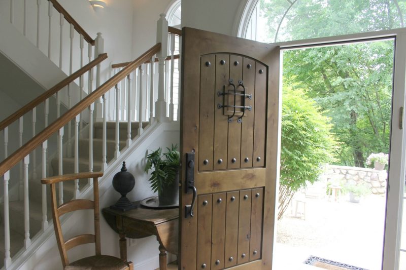 Entry way with alder front door by Hello Lovely Studio