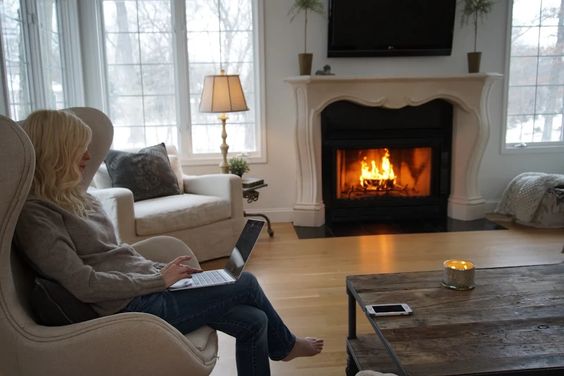 Belgian style in a living room with wood burning fireplace.