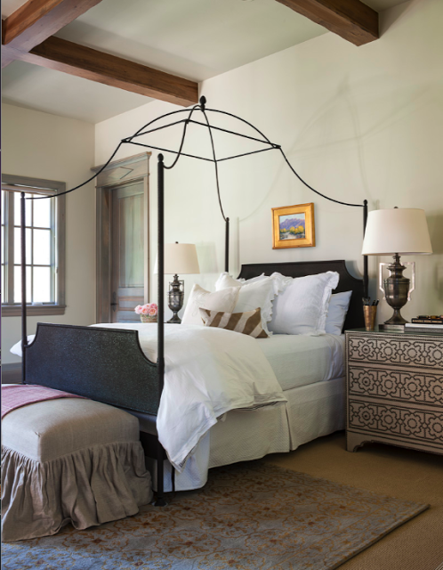 Interior design inspiration for French Country bedroom with delicate iron canopy bed and linen bench with ruffle. Design by Decor de Provence. #bedroomdecor #NordicFrench