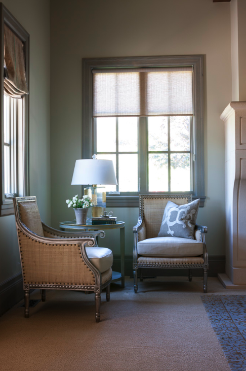 European inspired linen arm chairs with nailhead trim in a living room with custom stained blue grey trim and Nordic French style interiors. Decor de Provence.