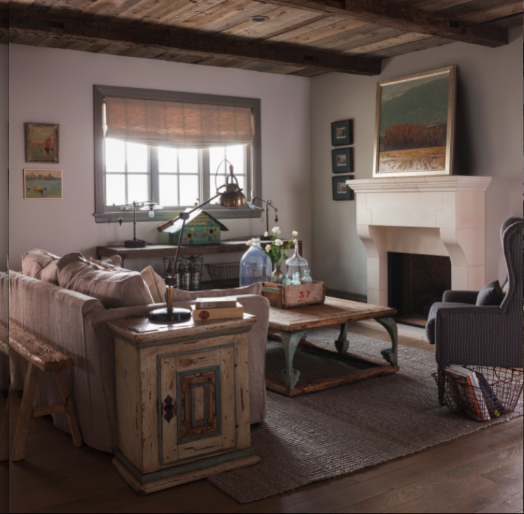 French country cottage cozy living room in a cottage with reclaimed wood ceilings, collected European antiques, and light grey stained trim. Decor de Provence.