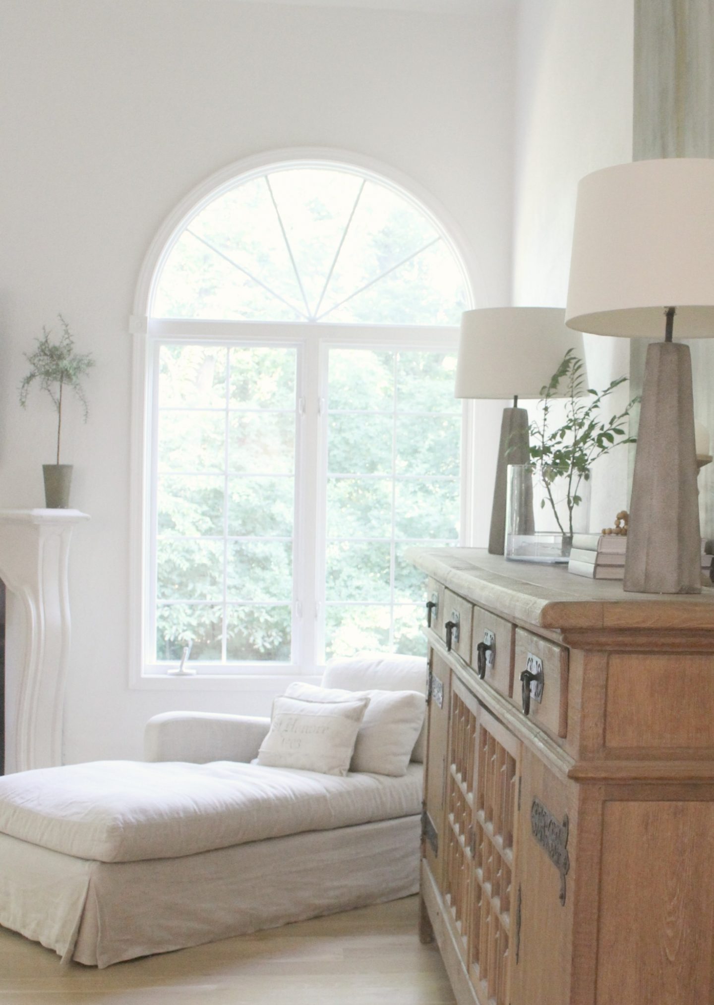 Belgian style living room with chaise and antique Belgian sideboard. Hello Lovely Studio.