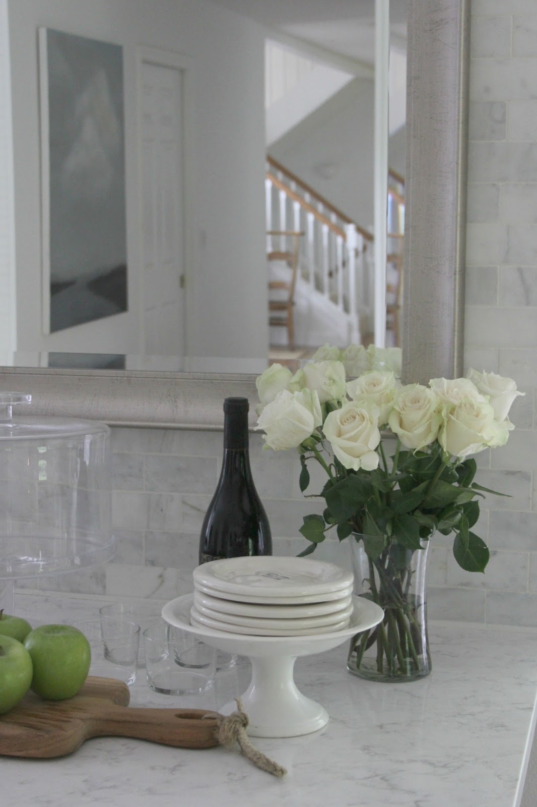 My white classic kitchen with Minuet quartz countertop, polished marble subway backsplash tile, and silver mirror. #hellolovelystudio #classickitchen #Minuet #Quartz #countertop