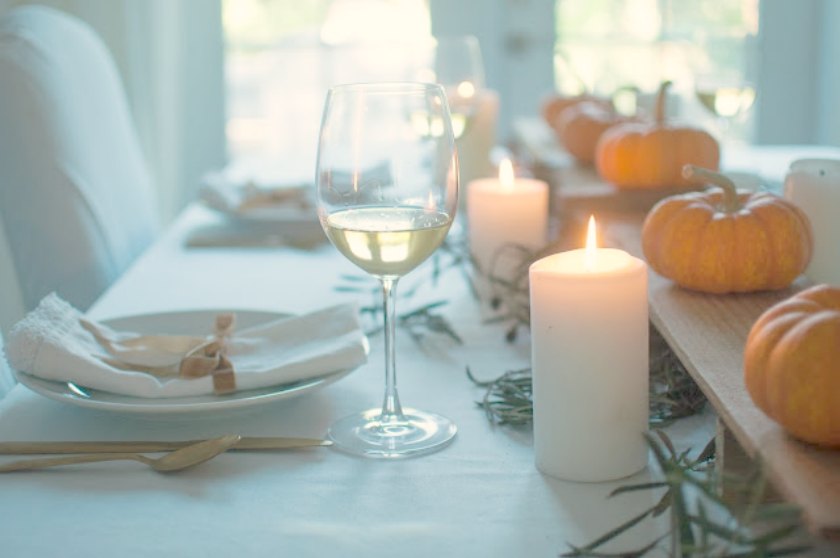 Calm and organic fall tablescape with simple pumpkins and candlelight - Gwen Moss for Hello Lovely