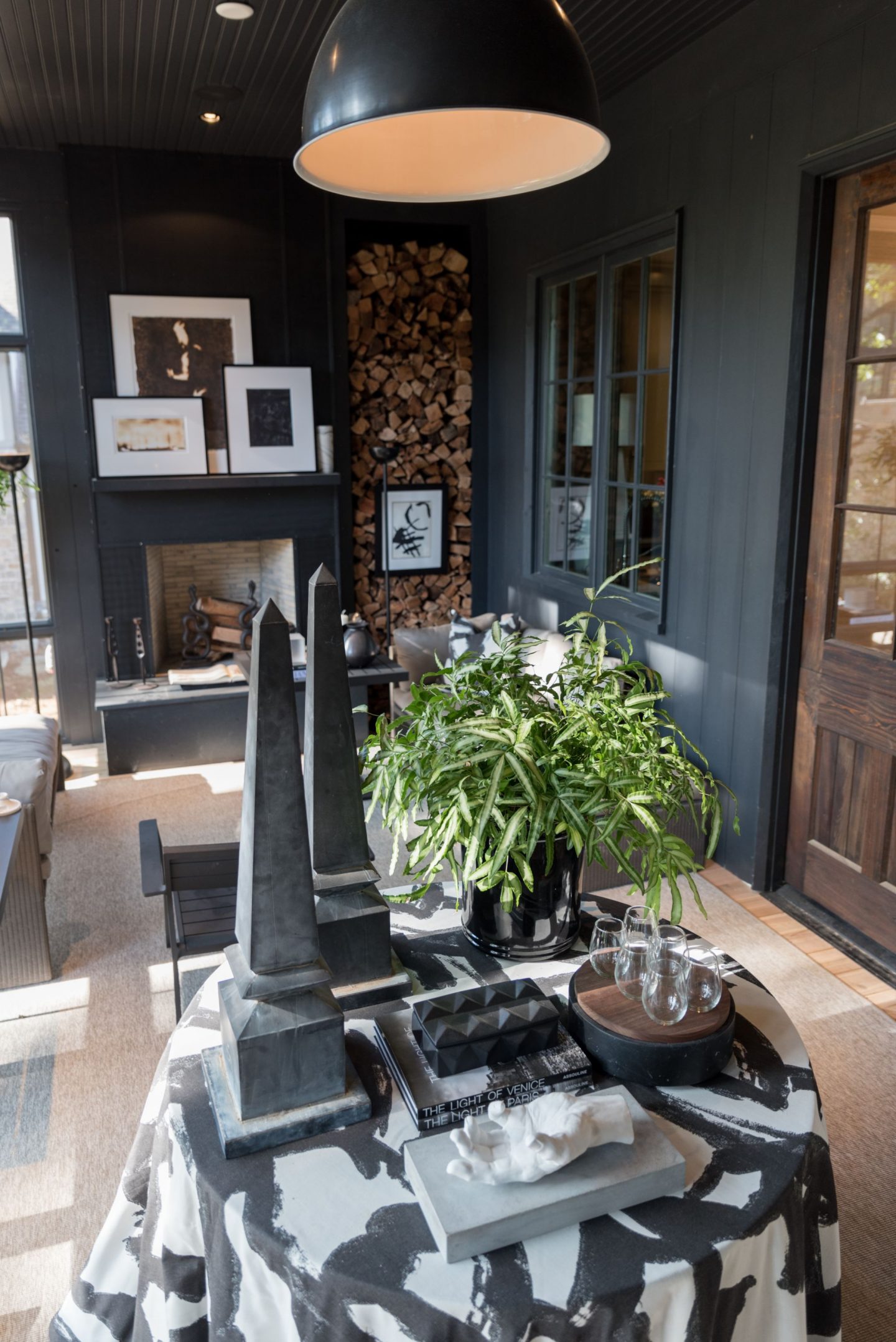 Moody dark woodwork in screened porch designed by Bob Brown for O'More Show House