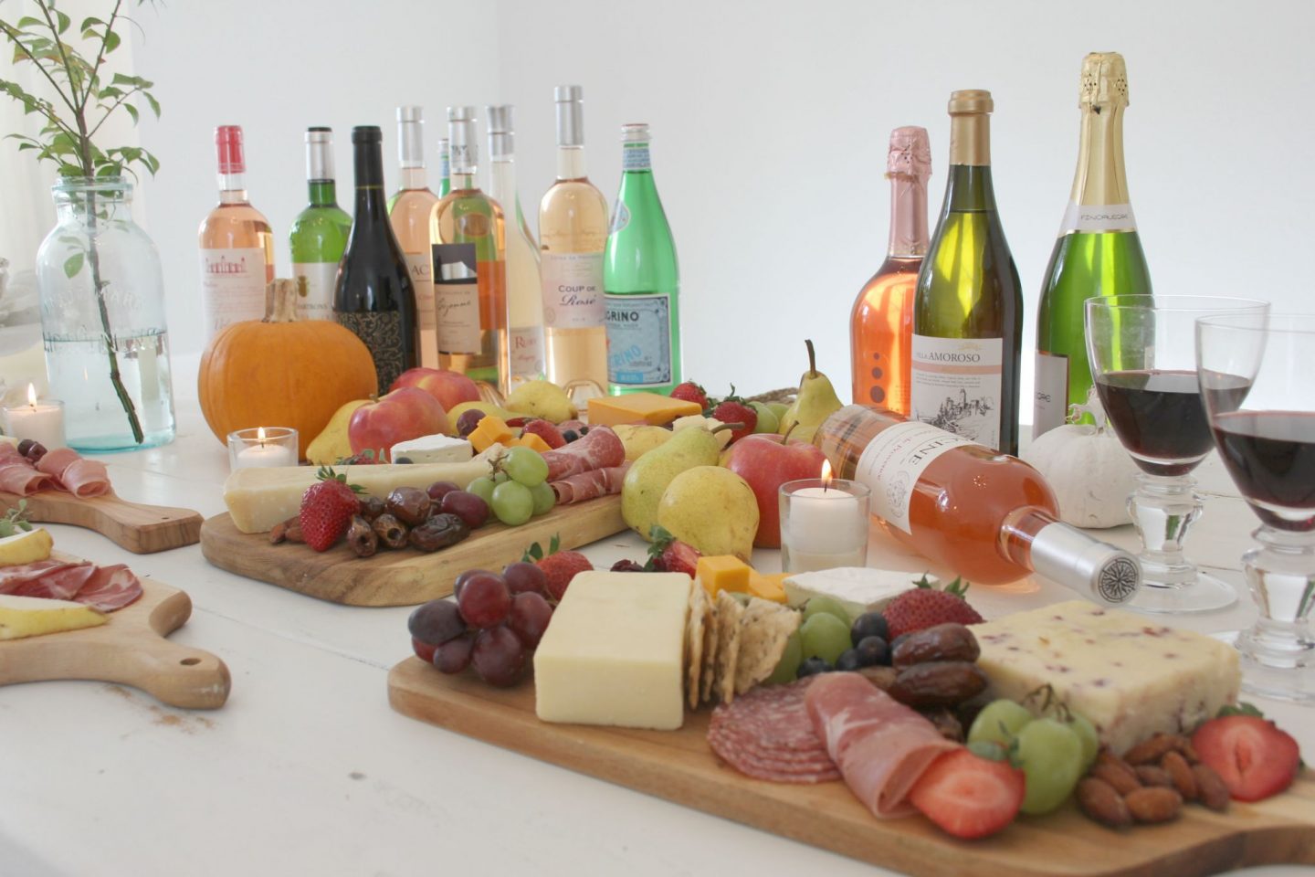 Gorgeous graze and cheese boards and charcuterie platters with wine for a party by Hello Lovely Studio