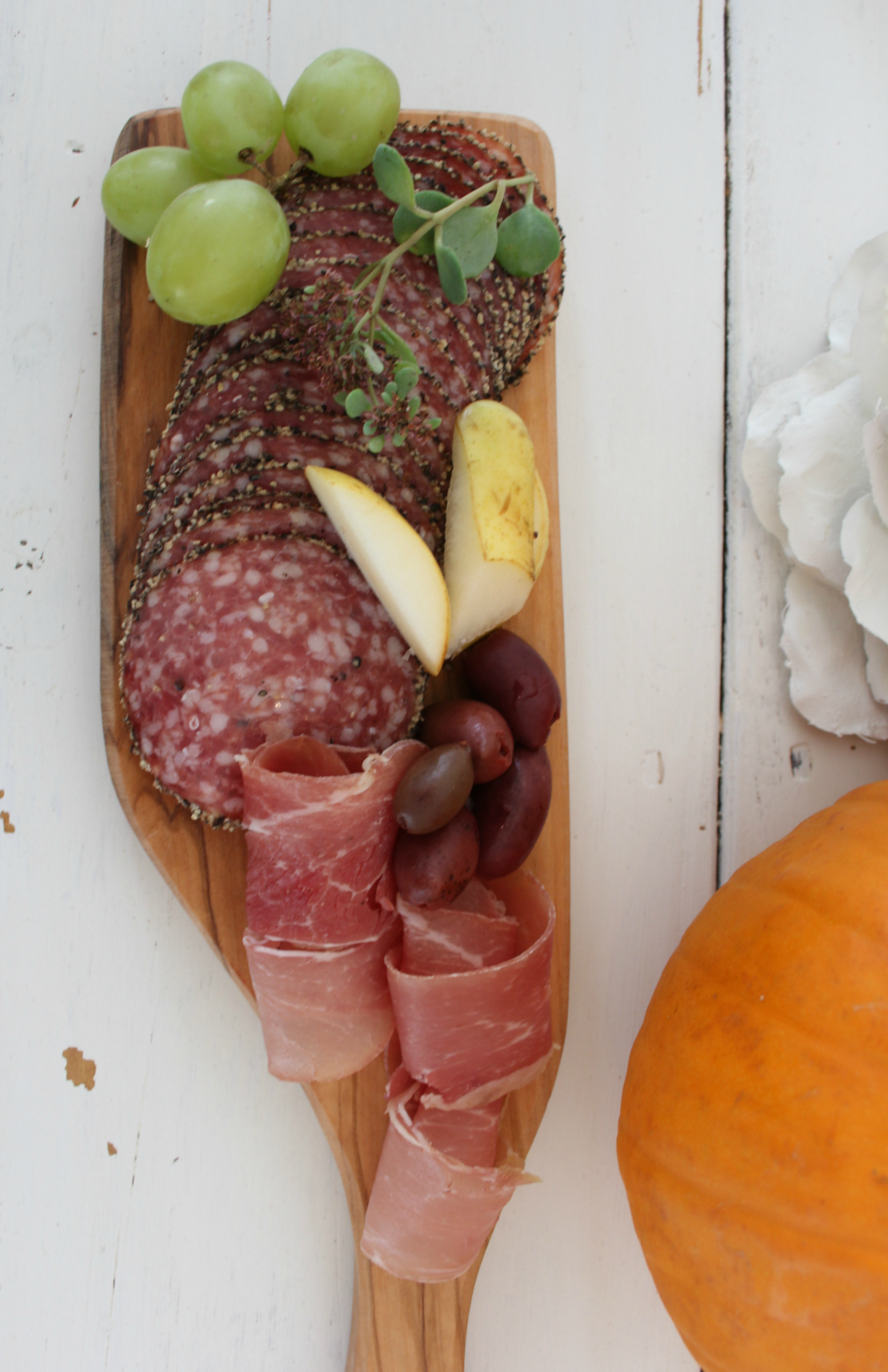 Easy Entertaining Idea With No Cooking or Baking! How to assemble a cheeseboard for a party or holiday. Let the food become the beautiful tablescape! Design/photo: Hello Lovely Studio. #hellolovelystudio #easyappetizer #easyentertaining #cheeseboard #wineandcheese #tablescape #simplerecipe #nocook #nobake #cocktailparty