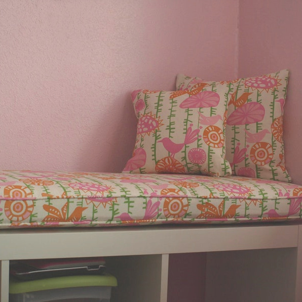 Kallax Ikea Hack inspiration for a banquette or bench in a bright pink kids room topped with a custom cushion from Hearth and Home Store. #kallaxhack #ikeahack #kallax #kallaxshelves #diy #banquette #kidsroom #bench #windowseat