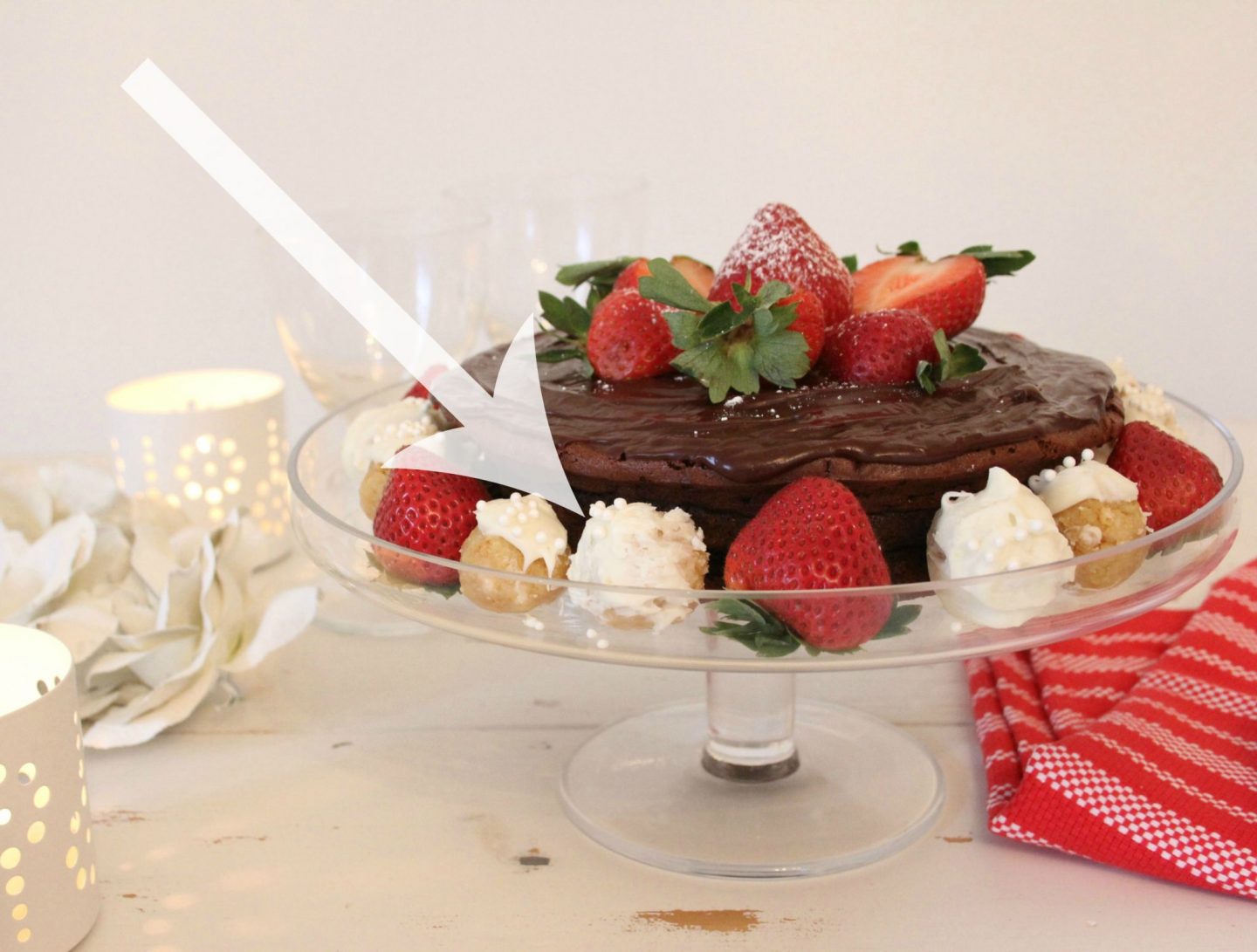 Beautiful chocolate cake with ganache icing, berries, and sugar cookie truffles by Hello Lovely Studio