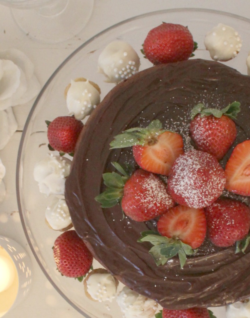 Beautiful chocolate cake with ganache icing, berries, and sugar cookie truffles by Hello Lovely Studio