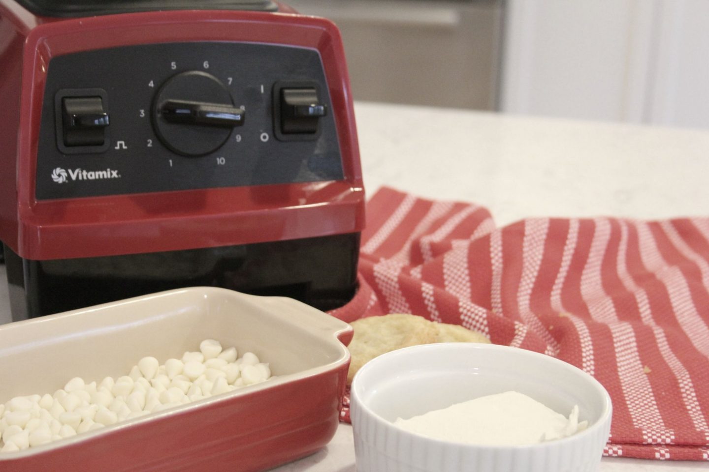 Red vitamix with ingredients for sugar cookie truffles by Hello Lovely Studio