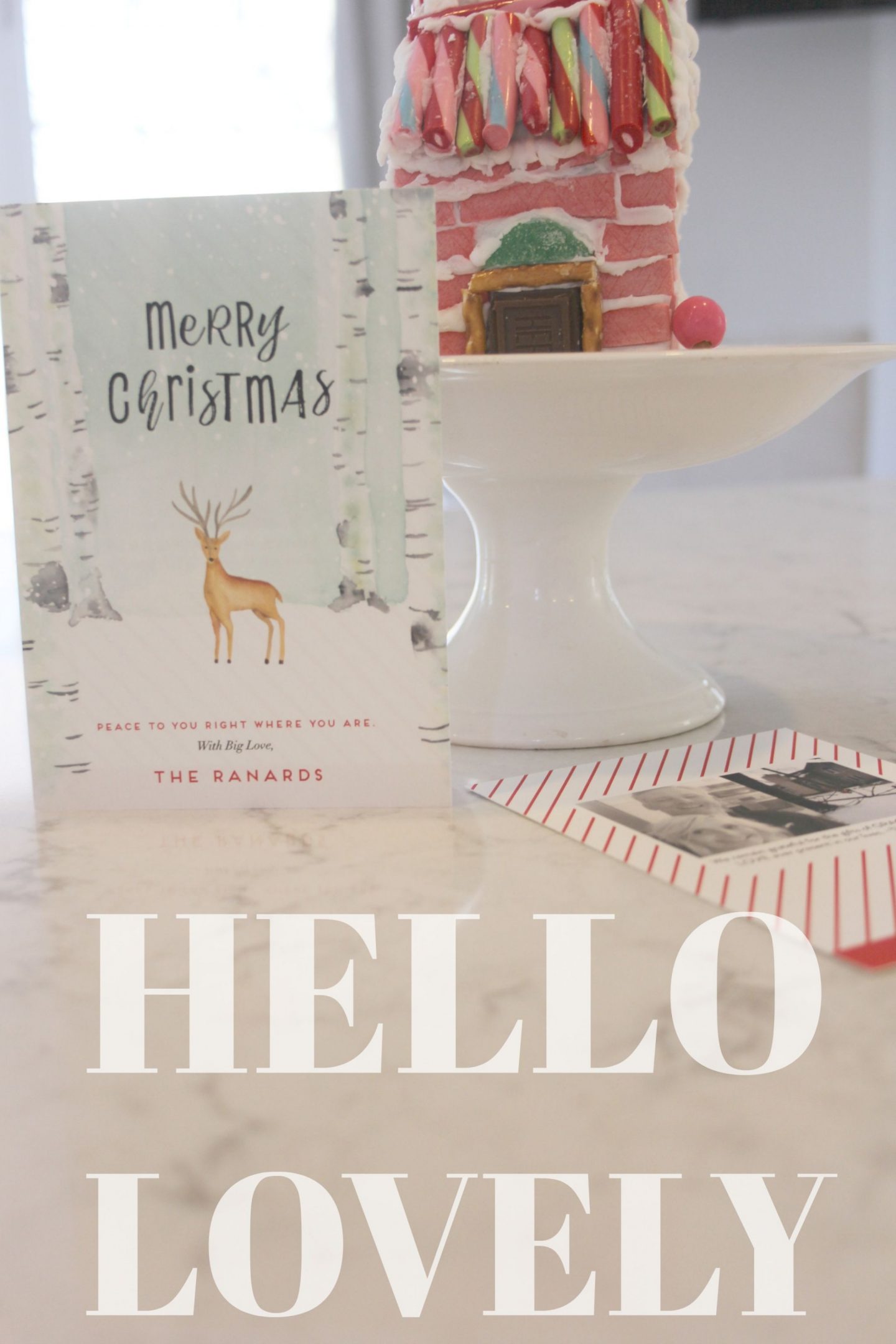 Holiday card from Minted plus my pink gingerbread house on a white pedestal - Hello Lovely Studio