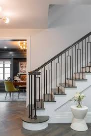 Drew Scott and Linda Phan's Honeymoon House on HGTV's Property Brothers - the entry with dramatic staircase as well as a glimpse of the office. #drew #linda #honeymoonhouse #propertybrothers #staircase