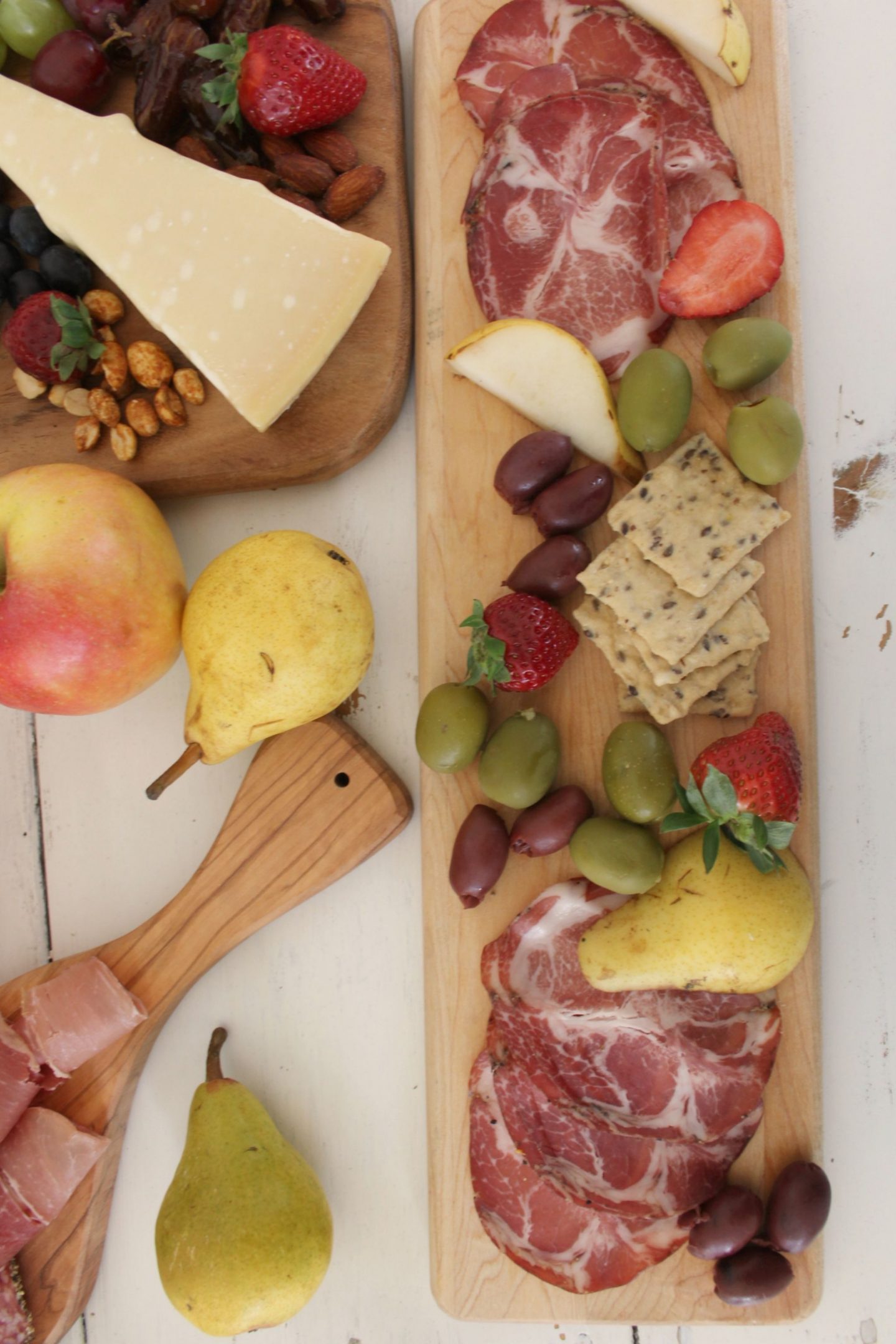 Beautiful colorful charcuterie and cheese platters with apples and pears by Hello Lovely Studio