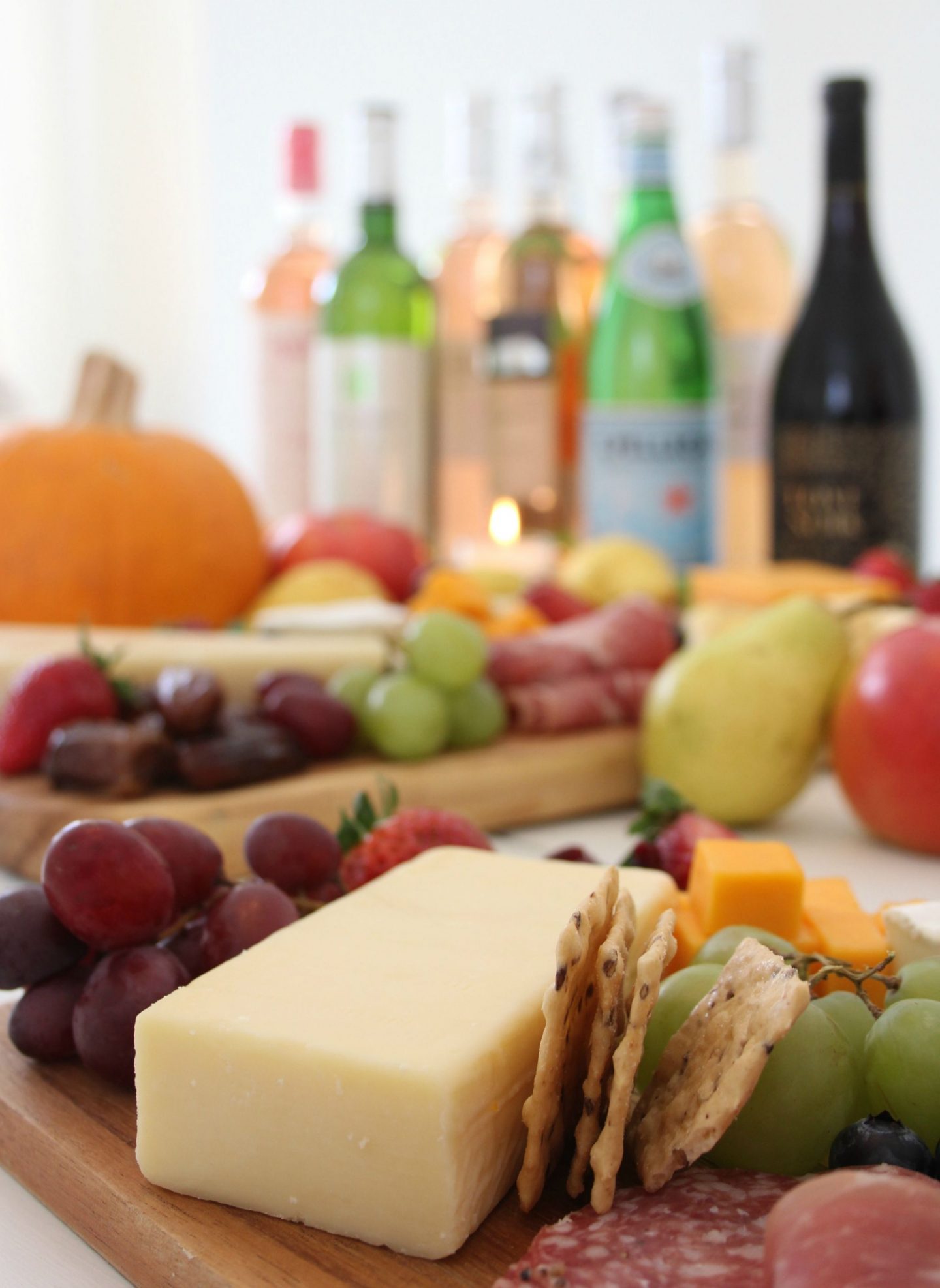 Beautiful colorful cheese boards and charcuterie platters with wine by Hello Lovely Studio