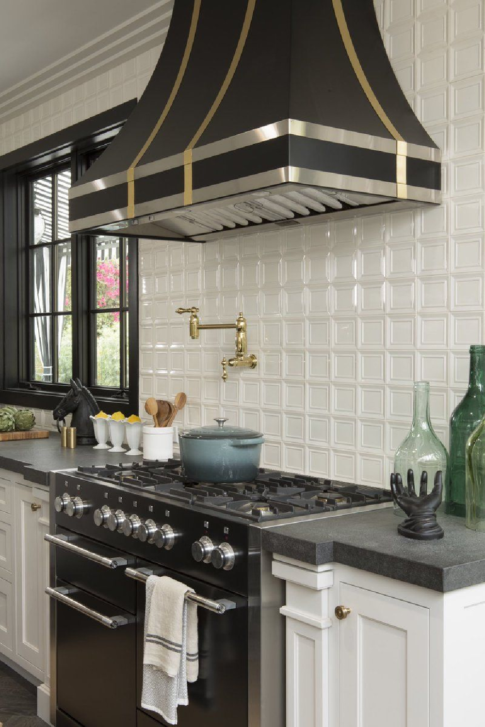 Drew's honeymoon house kitchen (a classic black and white 1920s beauty!) with Farrow & Ball Railings on island and trim. #drewscott #propertybrothers #honeymoonhouse #kitchen #railings