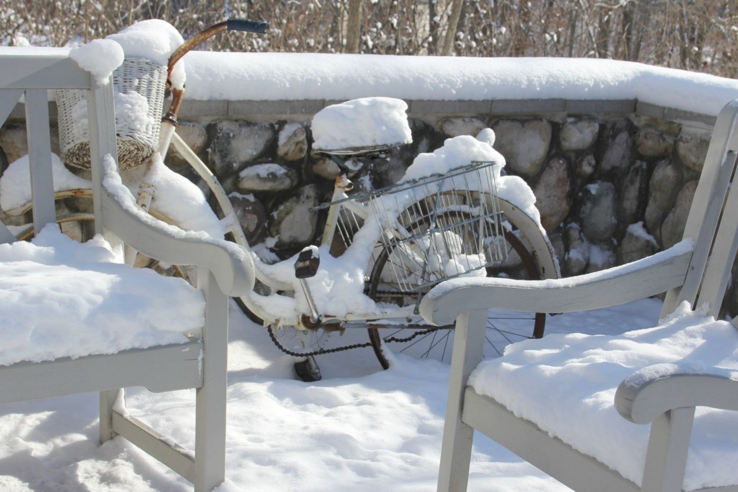 Snowy winter exterior of our simple cottage fixer upper in the woods - Hello Lovely Studio.