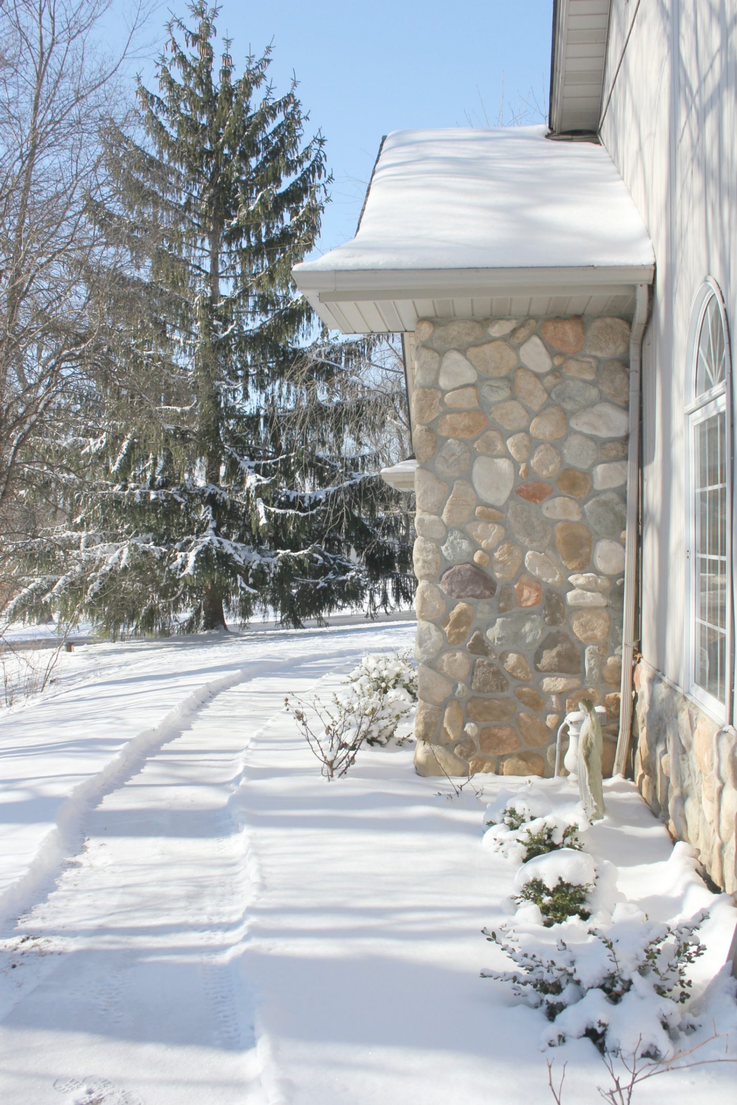 Snowy exterior of our cozy home in winter - Hello Lovely Studio.