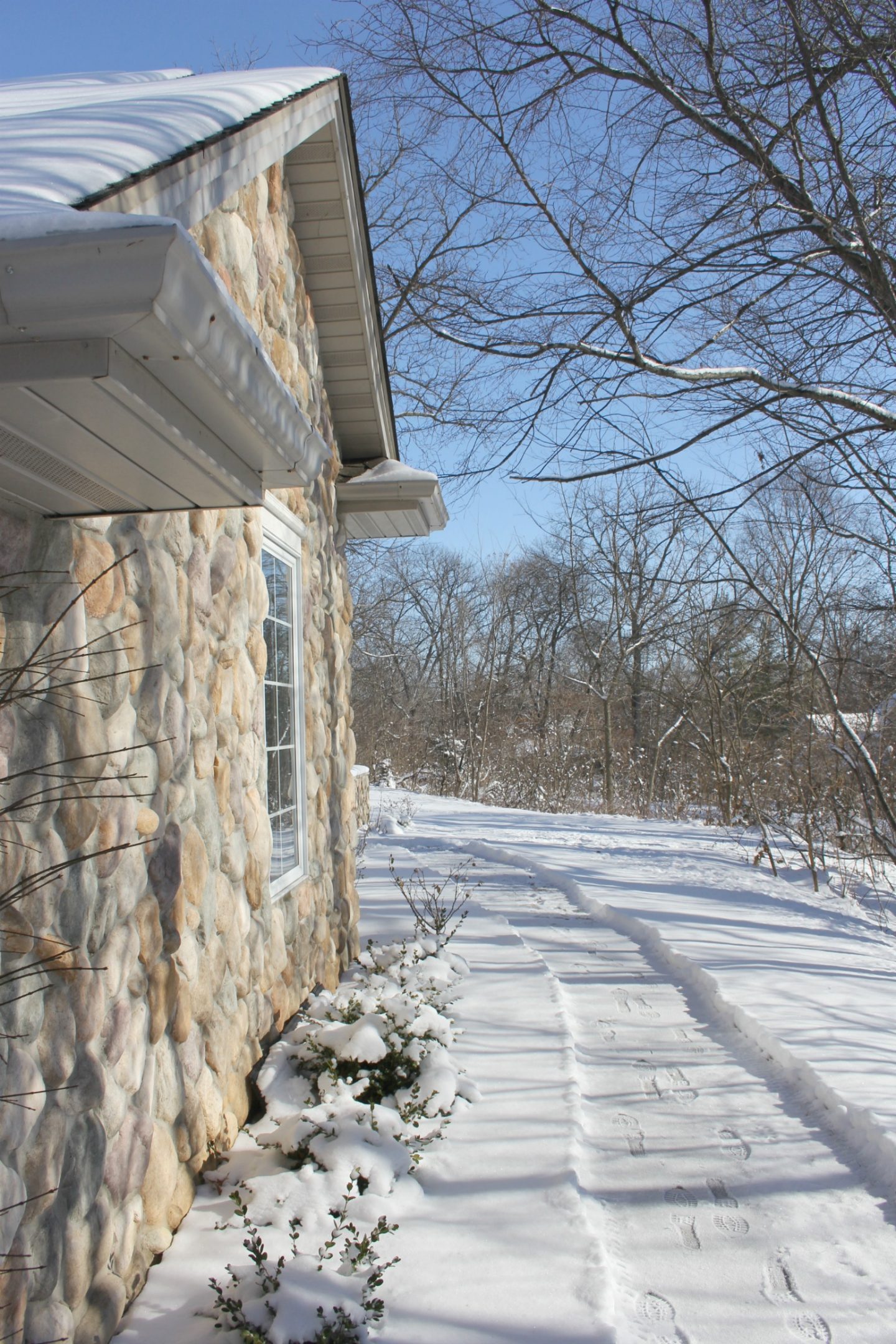 Snowy exterior of our cozy home in winter - Hello Lovely Studio.