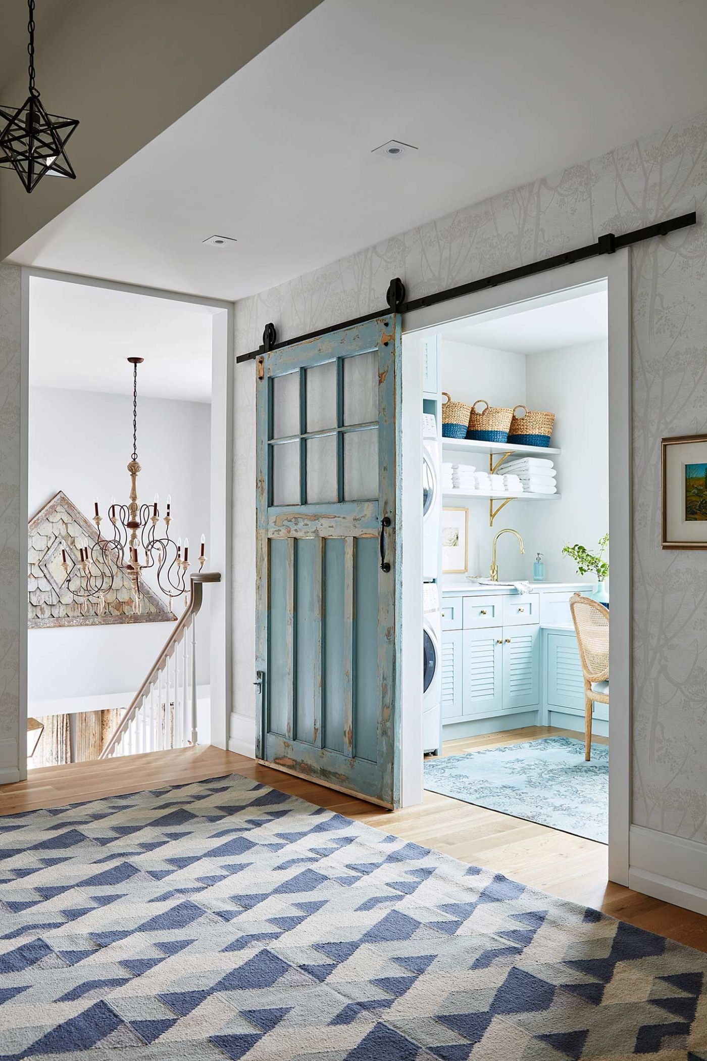 Beautiful sliding turquoise blue vintage door to laundry room in Sarah Richardson's off the grid house . #barndoor #vintagedoor #turquoise