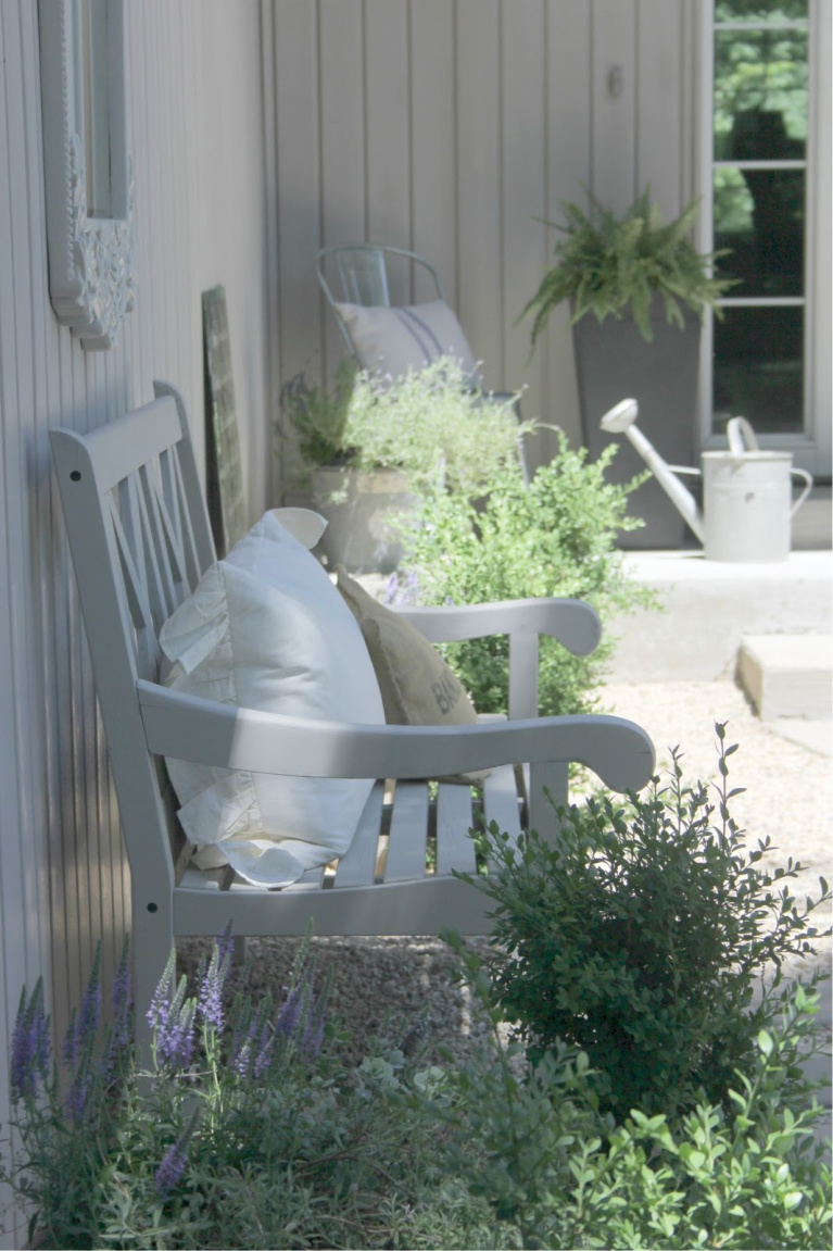 Charming French country inspired garden with pea gravel and boxwood. #hellolovelystudio #gardendecor #frenchfarmhouse #frenchcourtyard #peagravel #outdoordecor