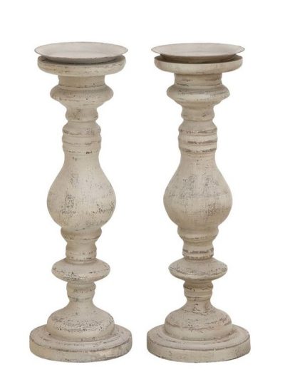 Turned candleholders made of wood and distressed are a beautiful French farmhouse accent.