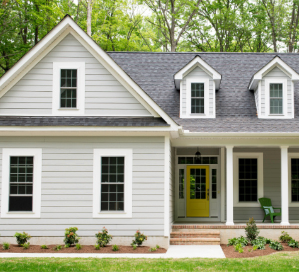 Behr Quiet Time paint color on a house exterior for a soothing, light grey green tranquil color. #paintcolors #behrquiettime #quiettime #lightgrey #housecolors