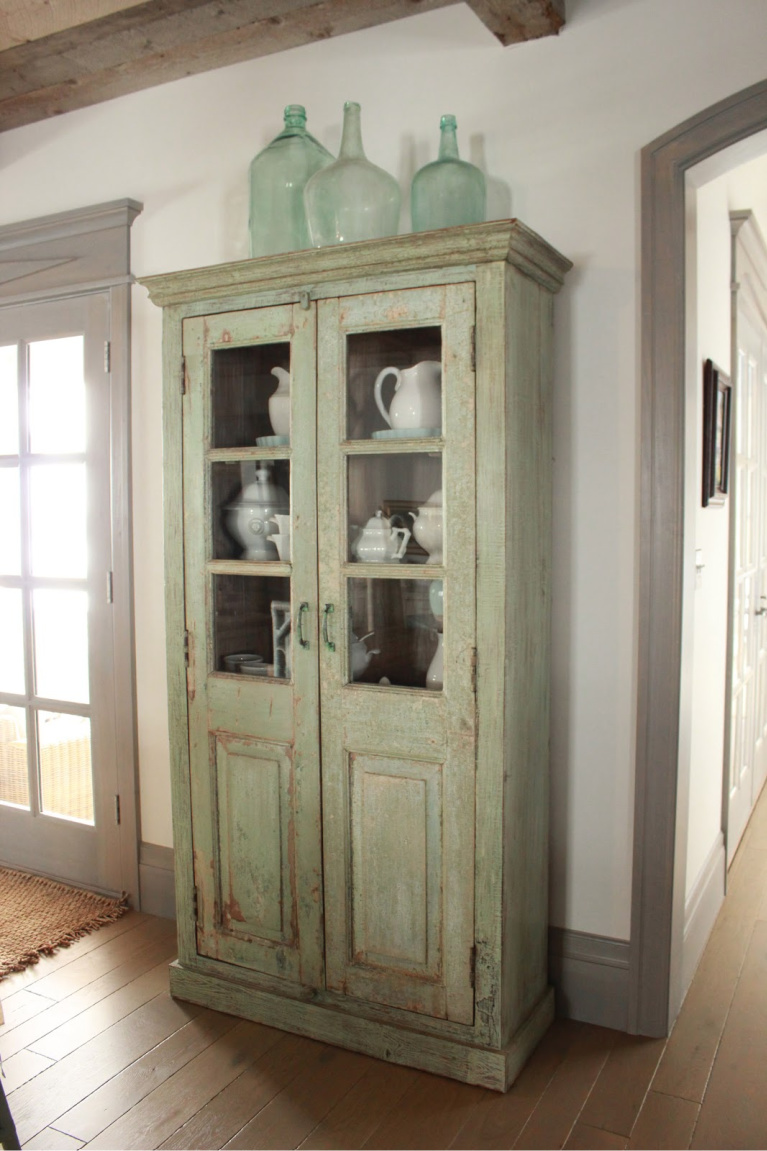 Vintage painted green cabinet in Country French Old World style in a newly built custom cottage home in Utah - Decor de Provence. #countryfrench #interiordesign #oldworldstyle #europeancountry