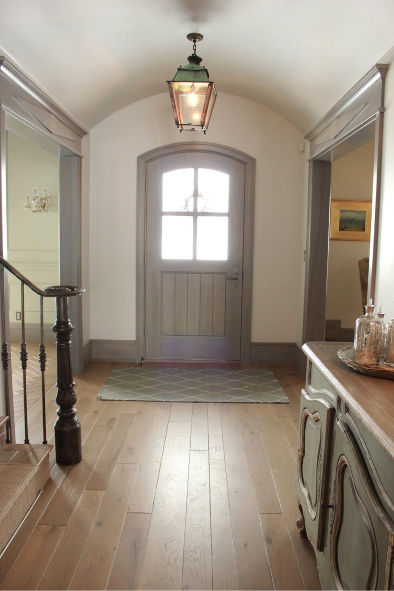 Arched front door in entry of Country French Old World style in a newly built custom cottage home in Utah - Decor de Provence. #countryfrench #interiordesign #oldworldstyle #europeancountry