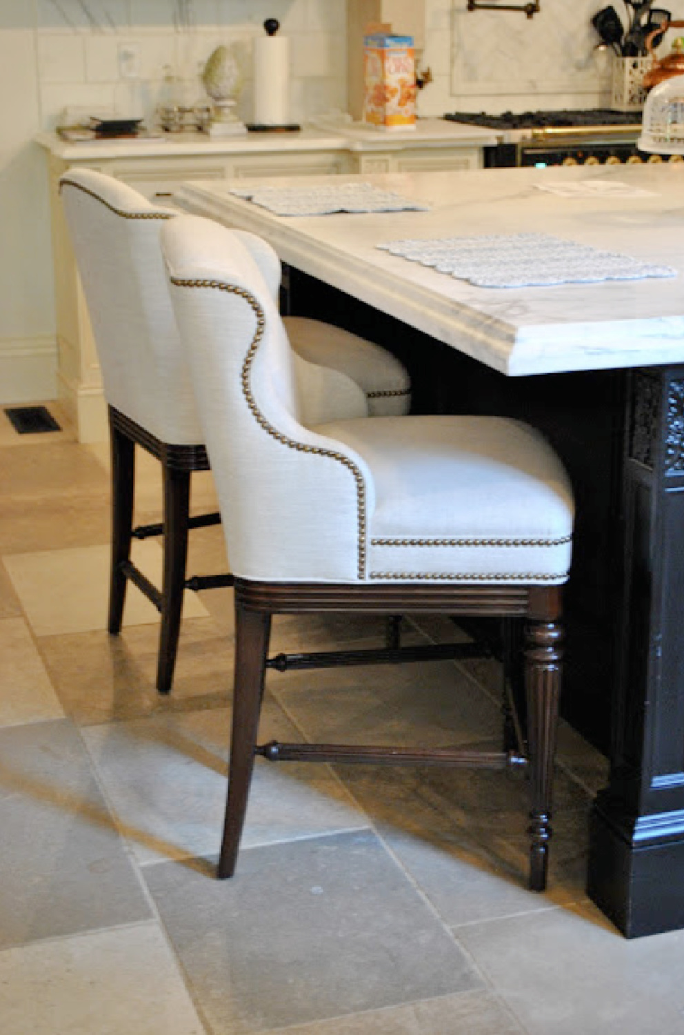 Detail of nailhead trim on counterstools in Tina's beautiful French country kitchen - The Enchanted Home.