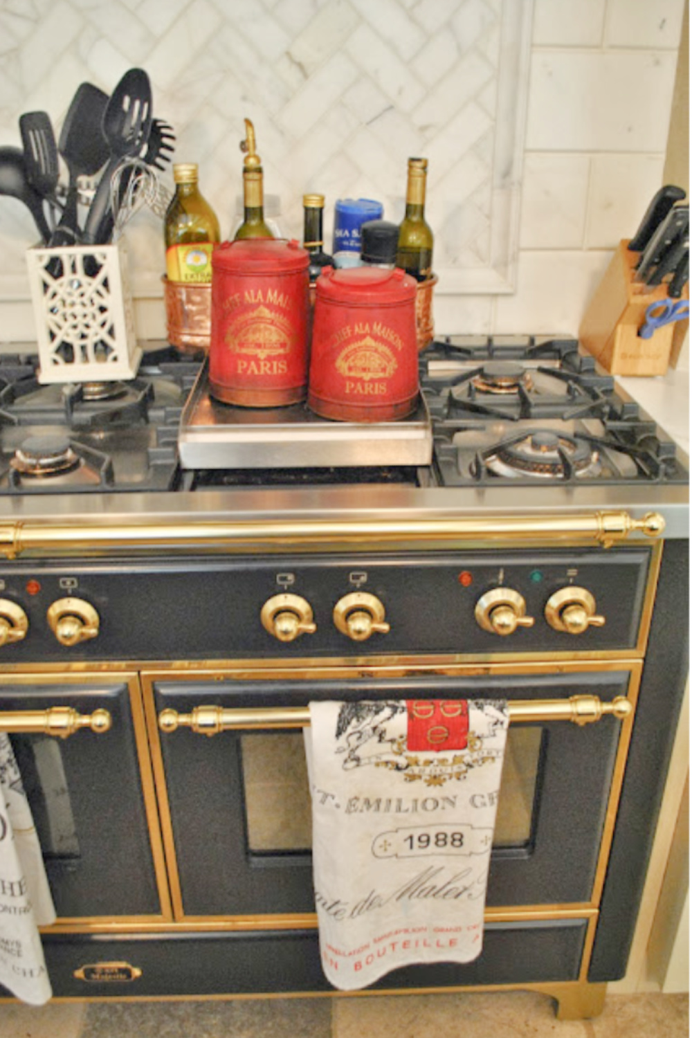 Beautiful black and gold French Lacanche range in Tina's beautiful kitchen - The Enchanted Home.