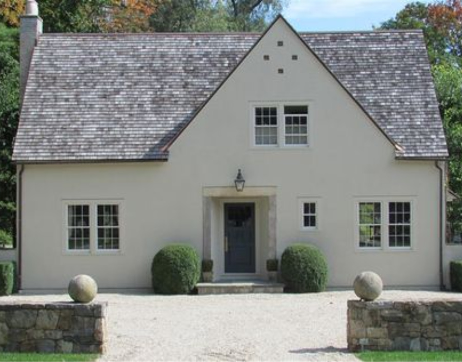 Stony Ground (Farrow & Ball) is the paint on the exterior of this cottage, and Hague Blue is the paint color on the front door. #farrowballstonyground #stonyground #farrowandballhagueblue #hagueblue #paintcolors #housecolors