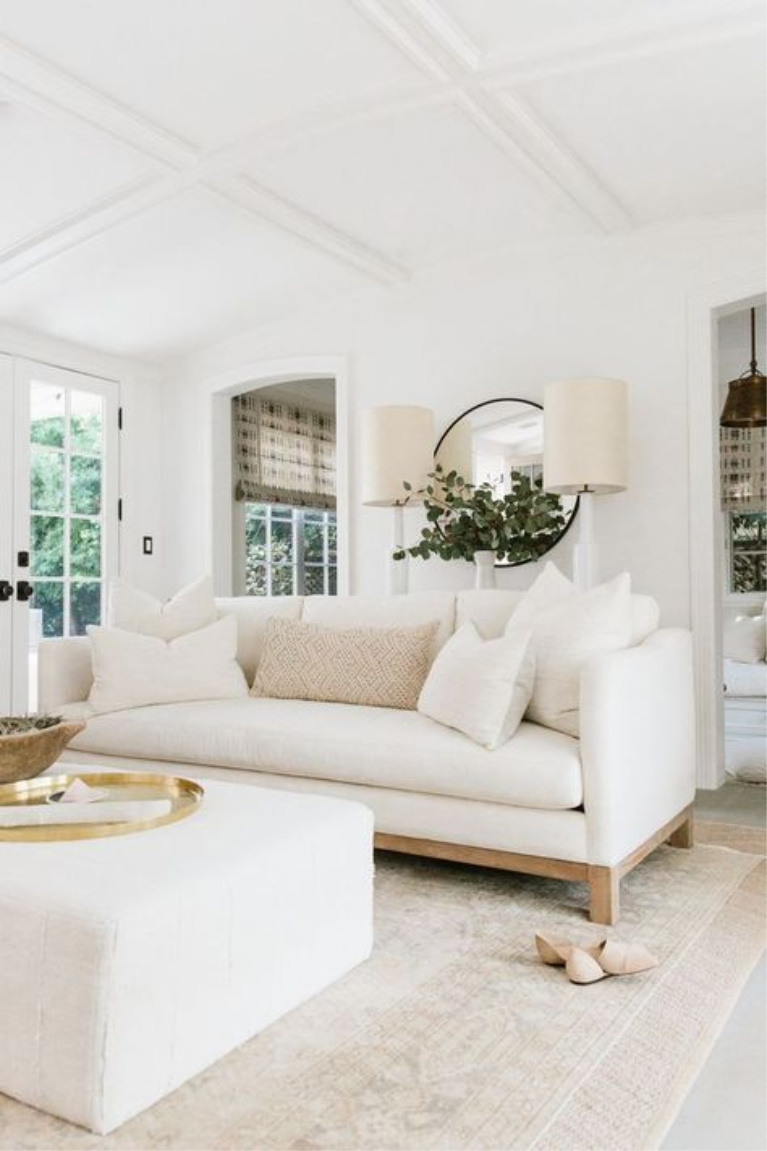 Erin Fetherston white living room painted Chantilly Lace. #allwhitedecor #benjaminmoorechantillylace