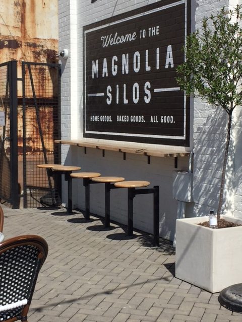 Magnolia Silos in Waco - Silos Baking Co. has a lovely outdoor patio with counter, bar stools, Parisian bistro chairs, and marble topped tables. #magnolia #silos #bakery