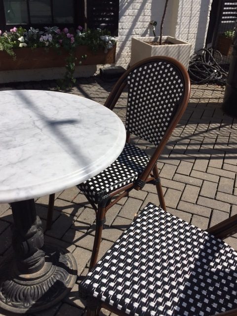 Black and white bistro chairs and marble cafe table at Silos Baking Co. at Magnolia Market in Waco, Texas. #magnolia #silos #bakery #patio