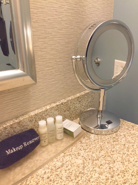 Lighted makeup mirror on counter in bathroom of Hotel Indigo Waco-Baylor. #makeupmirror #vanity #mirror