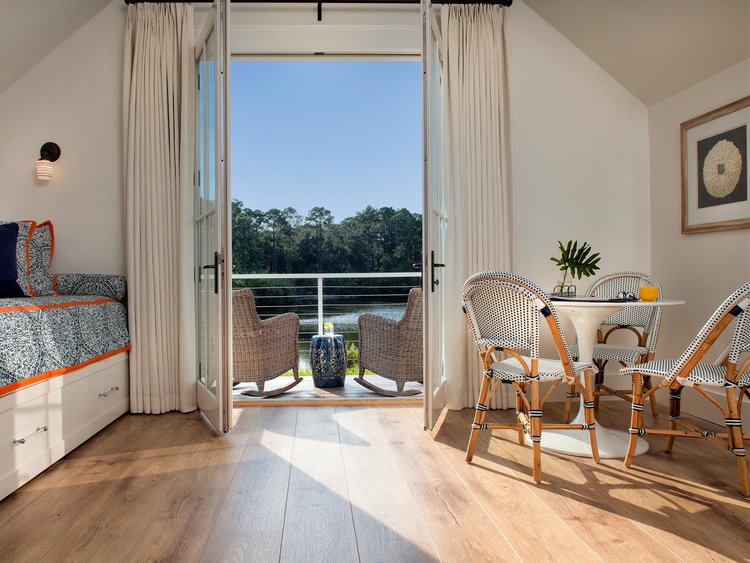 Carriage house. Board and batten coastal cottage in Palmetto Bluff with modern farmhouse interior design by Lisa Furey.